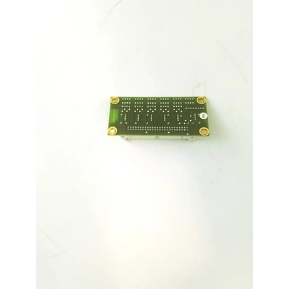 Green rectangular abx penta cbd177bg1-a pcb circuit board with gold mounting screws and a white circular sticker