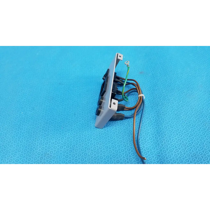 Back side of gray plastic ac power input plate assembly with switch fuse holder and multiple wires connected terminals