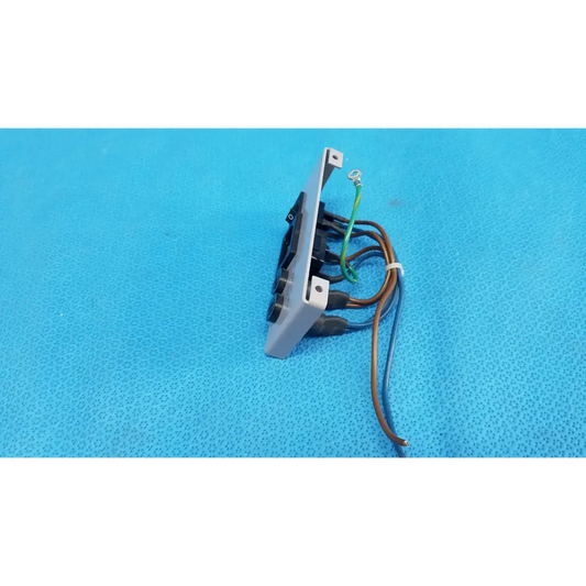 Back side of gray plastic ac power input plate assembly with switch fuse holder and multiple wires connected terminals