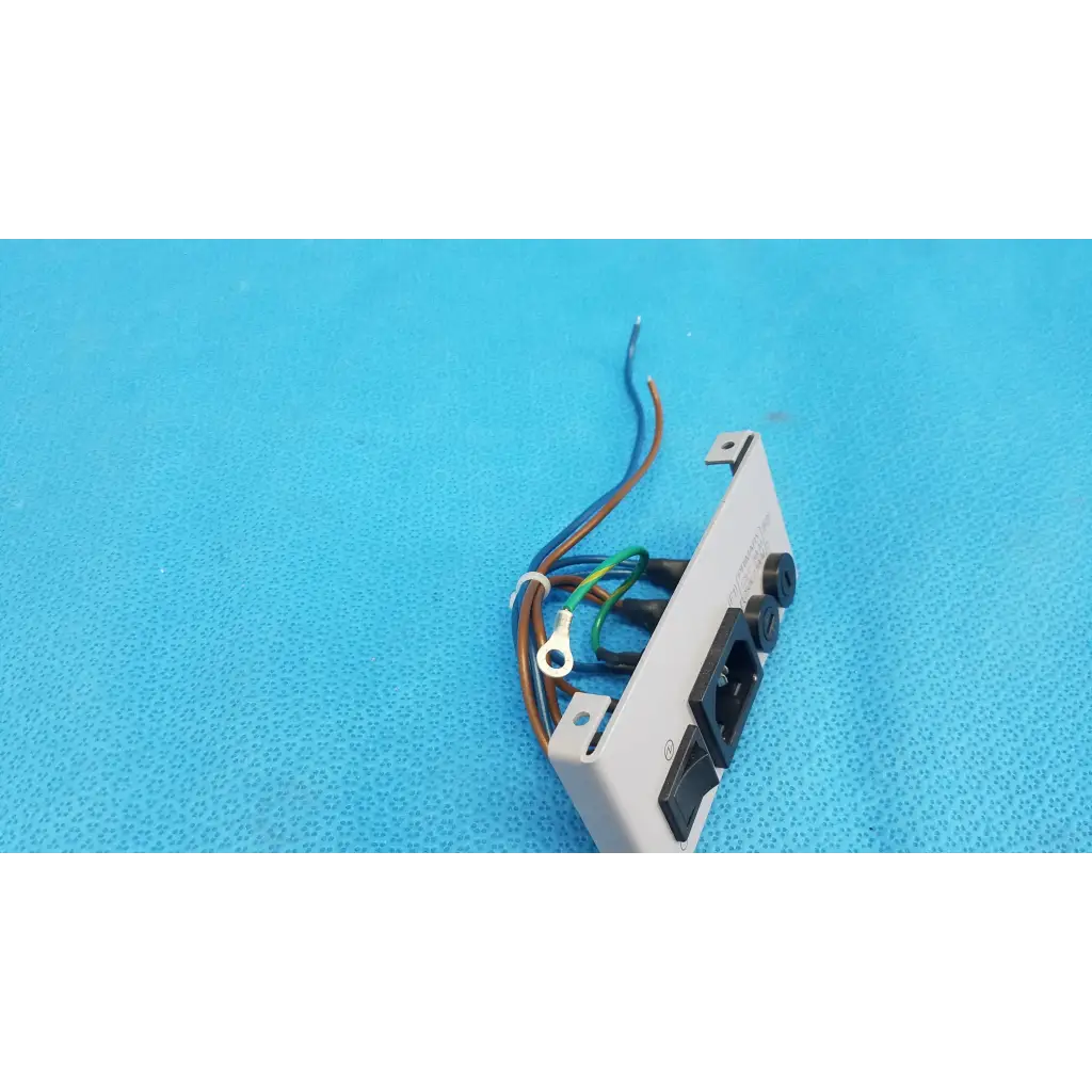 White plastic power input plate assembly with black sockets fuse holder and exposed wires for topcon trc-nw6s retinal camera back side
