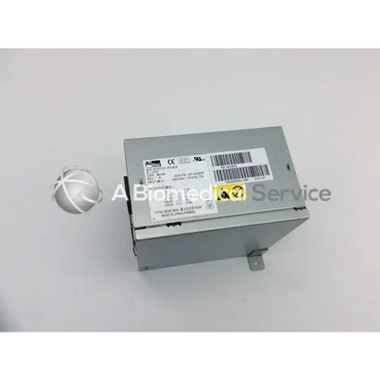 Silver metallic acbel api3po10 power supply 563w with labeled specifications and certification marks on its surface
