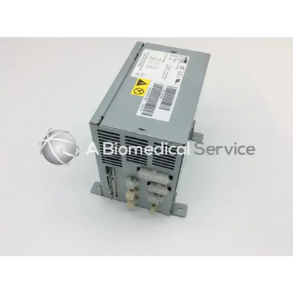 Gray metal acbel api3po10 power supply 563w with ventilation slots and labeled connectors on back side