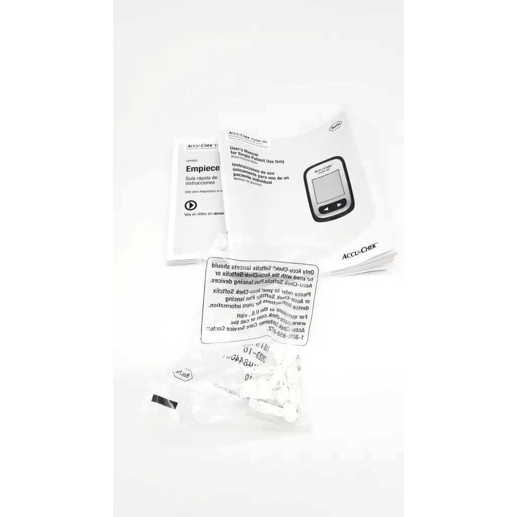 White accu-chek guide me blood glucose meter with black buttons and manuals for accurate glucose meter testing device use