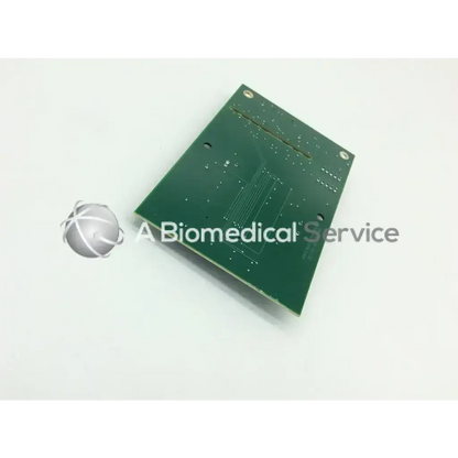 Green rectangular circuit board with silver solder points and copper traces for acist medical systems x-ray interface pcb