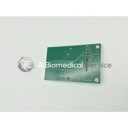 Green rectangular circuit board with silver soldered traces and holes for acist medical systems x-ray interface pcb model 301129-001