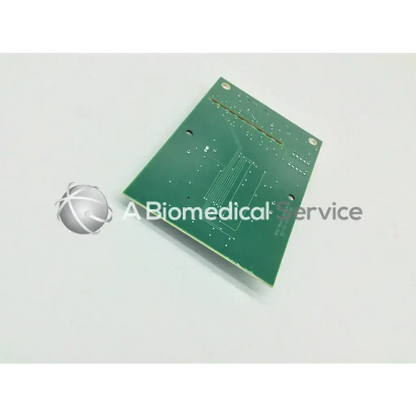 Green rectangular circuit board with silver soldered traces and mounting holes for acist medical systems x-ray interface pcb