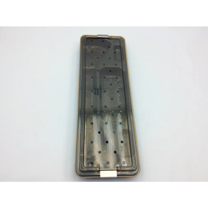 Transparent plastic acmi mra-gt telescope case with metallic hinge and perforated compartments for surgical tools organization