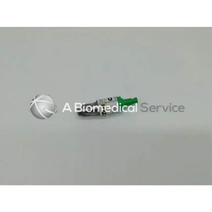 Green and silver acra-cut dgr-o 3mm medical device with cylindrical body labeled a biomedical service