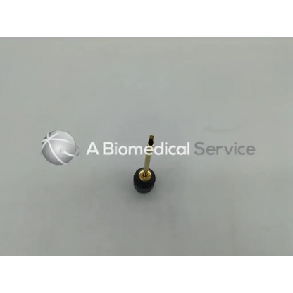 Gold-colored medical needle with black rubberized base for l391 arthroscopic arthroscopy shoulder reconstruction glenoid guide