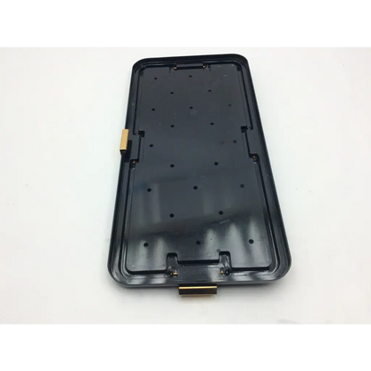 Black plastic acufex shoulder accessories tray phone case with gold metal latch and circular indentations on back side