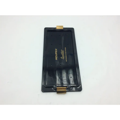 Black acufex suretac instrumentatio system tray with gold-colored metal clasps for secure medical instrument storage
