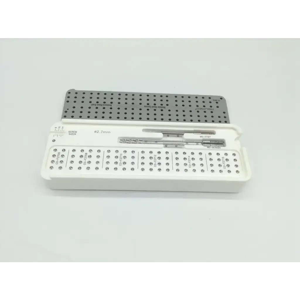 White plastic case holding acumed pl-wf01 acumed modular hand surgical drill bits and perforated metal plate with size markings