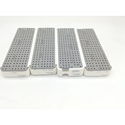 Four gray perforated surgical plates with white bases labeled reamtro for specific screws in acumed pl-wf01 modular hand set