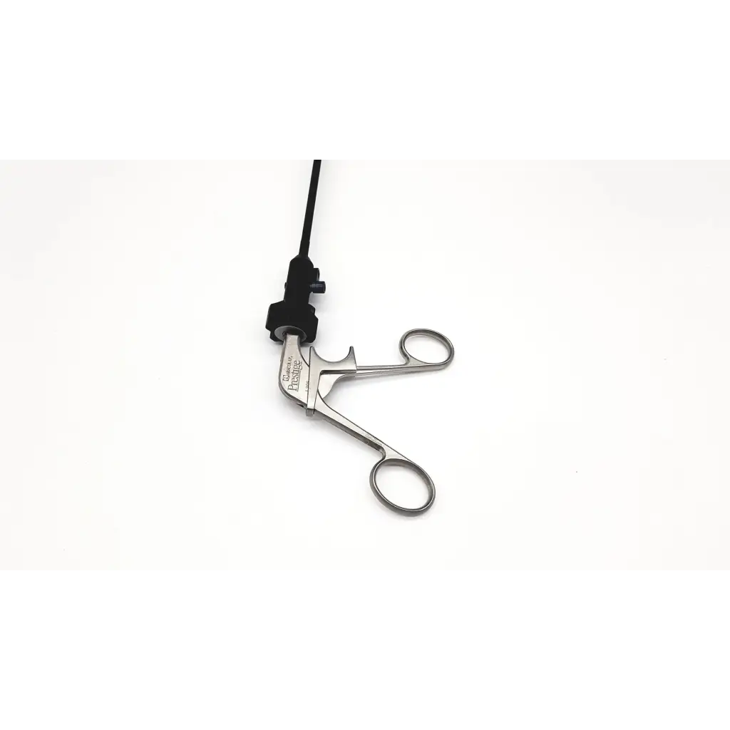 Silver atraumatic laparoscopic prestige grasping forceps with precision handles and sleek metallic finish with black cable