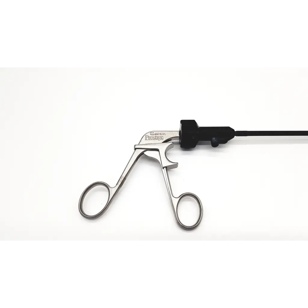 Silver atraumatic laparoscopic prestige grasping forceps with black handle and cable branded prestige on metallic body