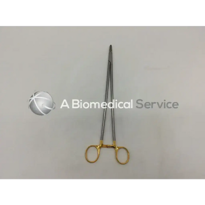 Aesculap bm047r needle holder with gold-colored handles and silver metallic jaws surgical clamp