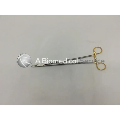 Aesculap bm047r needle holder with gold-handled, precision-engineered metallic jaws for surgical use