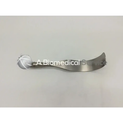 Silver aesculap bt614r deaver retractor with curved metallic blade and spherical handle engraved with cross pattern