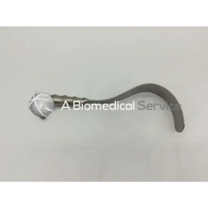 Silver metallic aesculap bt614r deaver retractor with curved handle and white crosshatch on spherical end