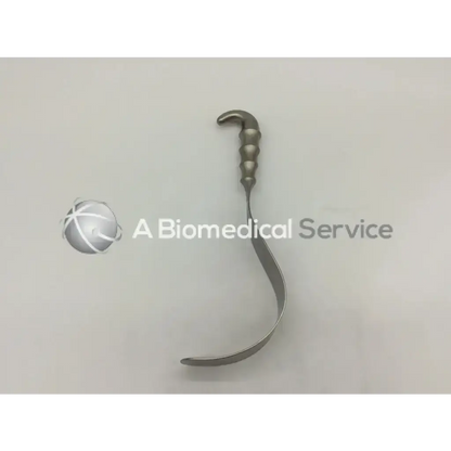 Silver aesculap bt614r deaver retractor with curved textured handle and smooth elongated blade in stainless steel