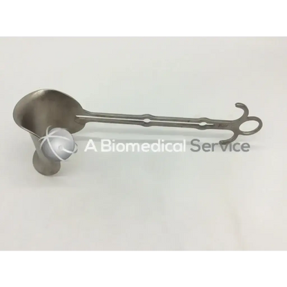 Silver aesculap bv609r retractor with curved spoon-like end and ornate handle designed for surgical use