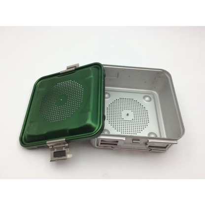 Green plastic lid with perforated retention plate on stainless steel aesculap half-size sterilization container
