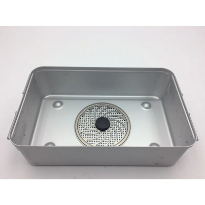 Silver metal baking pan with circular perforated drain insert and black knob inside aesculap jn742 with jf253r tray
