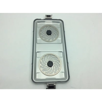 Silver metallic dual-burner portable grill with circular perforated plates and black knobs in aesculap sterile container system jk 444