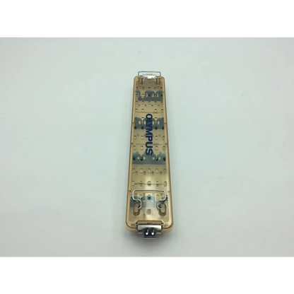 Transparent gold-colored olympus wa05990a camera battery pack with metallic contacts for aesculap sterilization container use