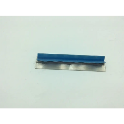 Blue rubberized edge trowel with metallic blade shown with aesculap sterilization container and olympus wa05990a parts