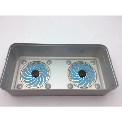 Silver rectangular metal sterilization tray jf224r with two circular blue and black fan-like inserts by aesculap