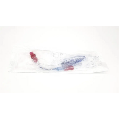Clear plastic intubating laryngeal airway cookgas with red caps and blue components in sterile wrapper