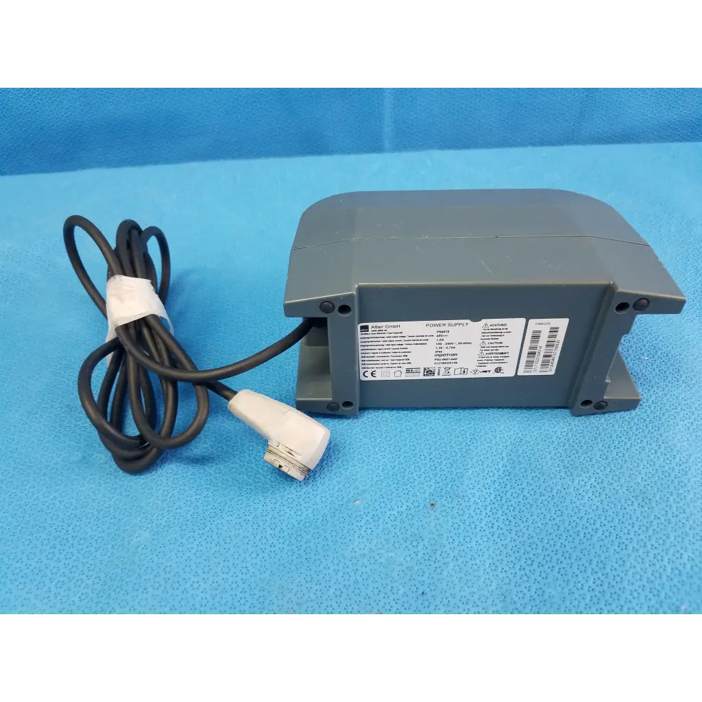 Gray plastic alber e-fix viamobil power supply unit with black coiled cable and white connector model ps4515