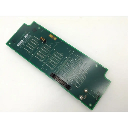 Green rectangular Alcon 202-1514-501 controller circuit board with silver traces and various electronic components