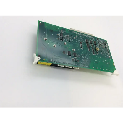 Green printed circuit board with black integrated circuits and silver screws in alcon accurus soa board assembly