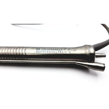 Alcon centrurion ozil silver metallic handpiece with textured grip and engraved serial number 8065751761