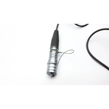 Silver metallic alcon centrurion ozil handpiece with black rubber grip and attached cable for dental use