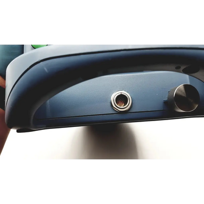 Blue plastic alcon infiniti vision footswitch with circular metallic port and knurled adjustment knob with cable