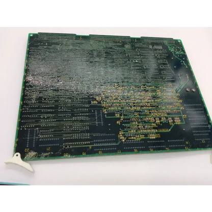 Green rectangular aloka ep-3320h printed circuit board with gold-colored traces and 74hc541ap bbcf5-6 components