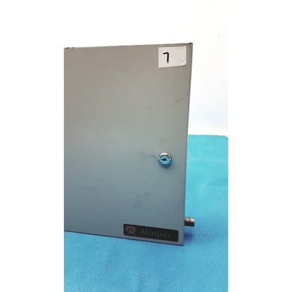 Gray metallic altronix al400ulx power supply charger enclosure with keyed lock and small protruding connector