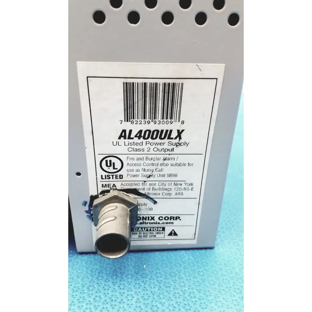 Gray metal altronix al400ulx power supply with threaded connector and white label for 12vdc or 24vdc use