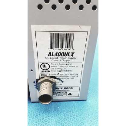 Gray metal altronix al400ulx power supply with threaded connector and white label for 12vdc or 24vdc use