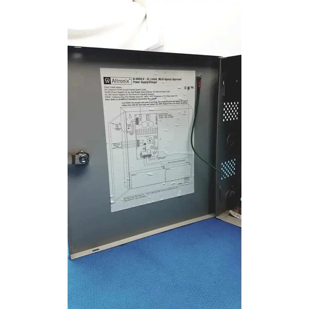 Altronix al400ulx power supply charger with metallic gray enclosure and visible internal wiring for multi-agency use
