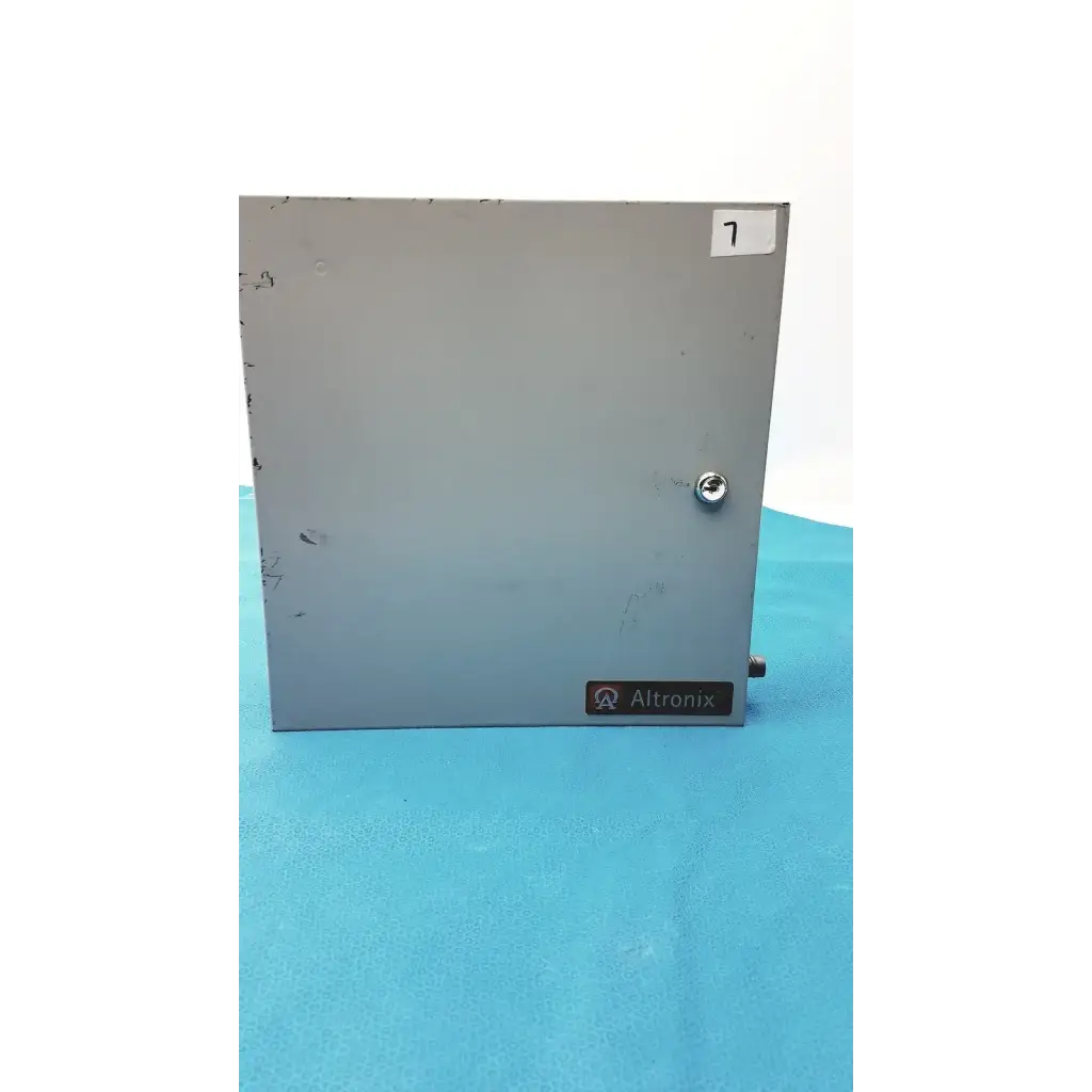 Gray metal industrial enclosure with silver screw and altronix label on the altronix al400ulx power supply charger