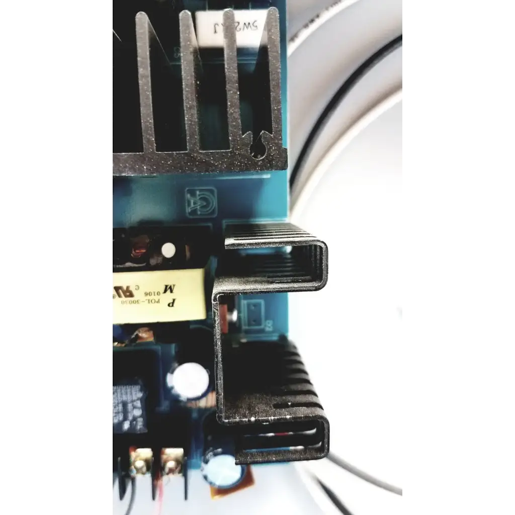 Black metal heat sink with ribbed design on altronix al400ulx power supply charger circuit board