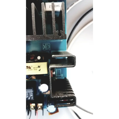 Black metal heat sink with ribbed design on altronix al400ulx power supply charger circuit board