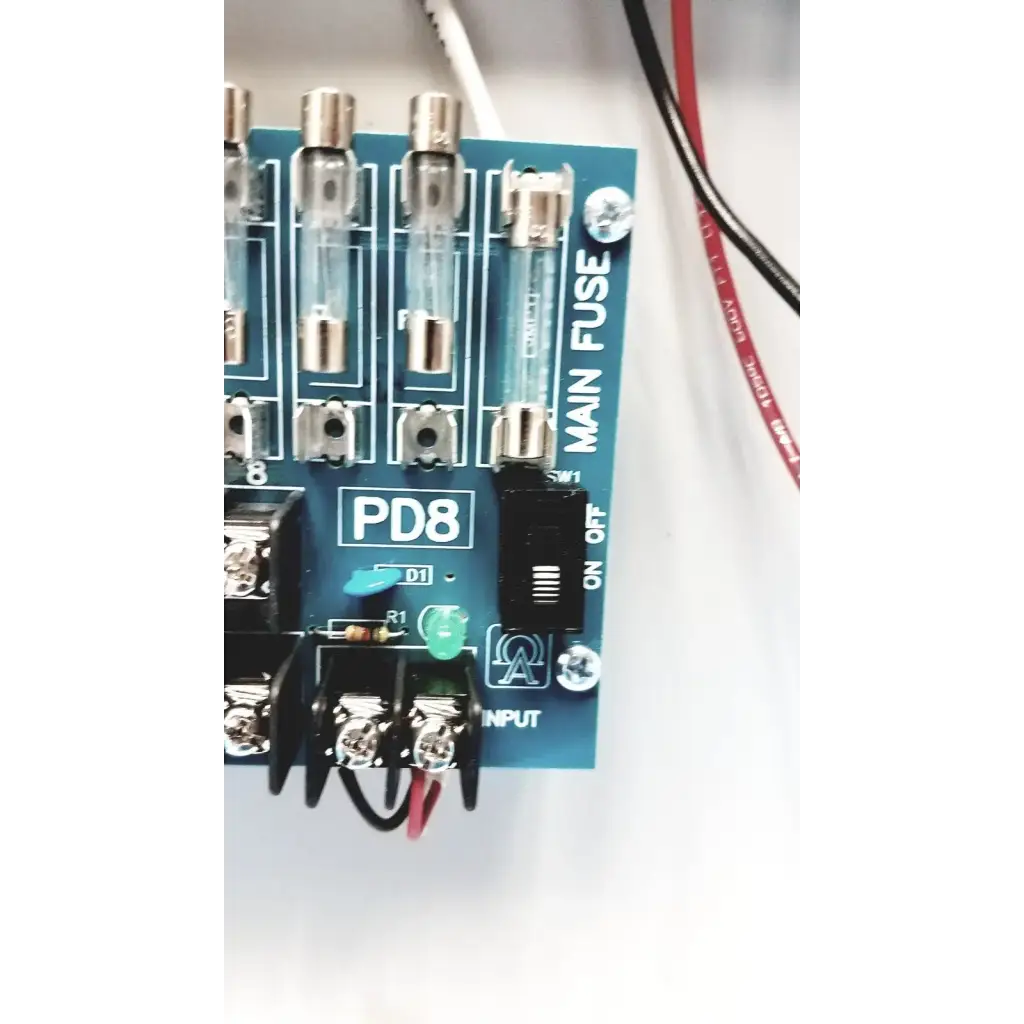 Blue circuit board of altronix smp5ctx high current power supply charger with eight glass fuses and on off switch