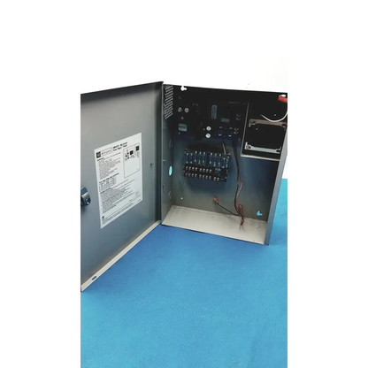 Gray metal electrical control panel of altronix smp5ctx high current power supply charger with visible wiring
