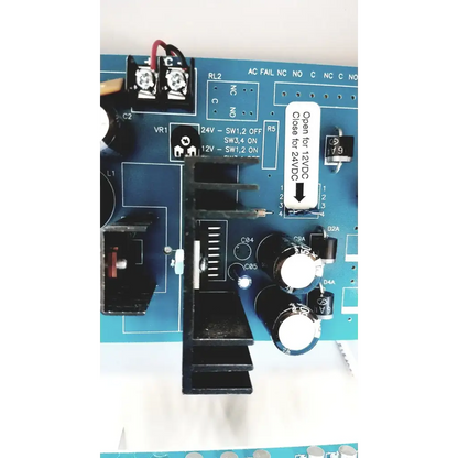 Blue circuit board with black components and white labeling of altronix smp5ctx high current power supply charger 12vdc 24vdc