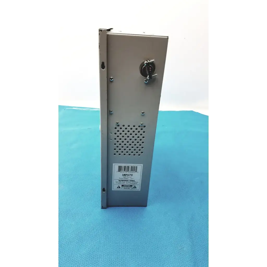 Silver metallic altronix smp5ctx high current power supply charger with perforated ventilation and top circular connector